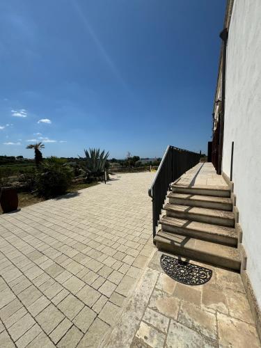 a set of stairs next to a building at Borgo Angelica B&B in Leporano Marina