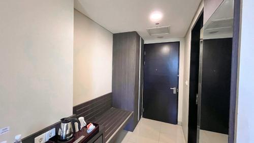 a room with a elevator and a door to a room at Grandia Hotel in Bandung