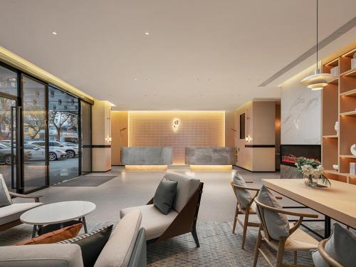 Posezení v ubytování Country Inn & Suite by Radisson, Guangzhou Railway Station Xiaobei