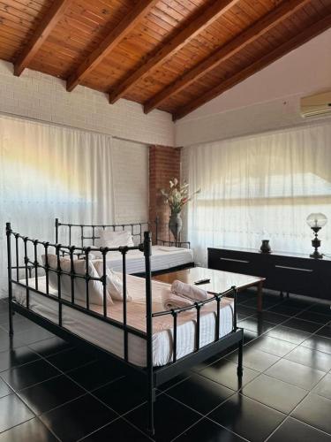a bedroom with two bunk beds and a table at Polyxeni Apartments & Rooms in Qeparo