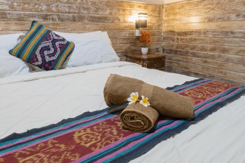 En eller flere senge i et værelse på The Mel Homestay