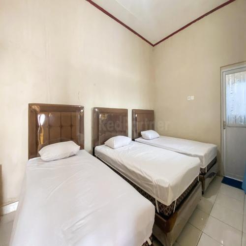 Katil atau katil-katil dalam bilik di Sutomo Residence Syariah RedPartner