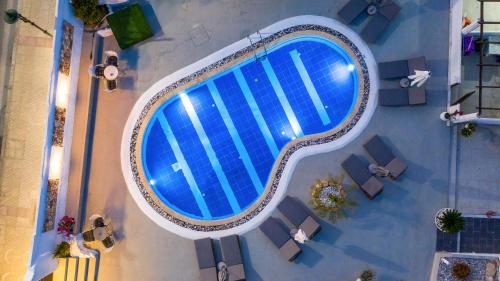 an overhead view of a swimming pool in a building at Toula's Apartments in Faliraki