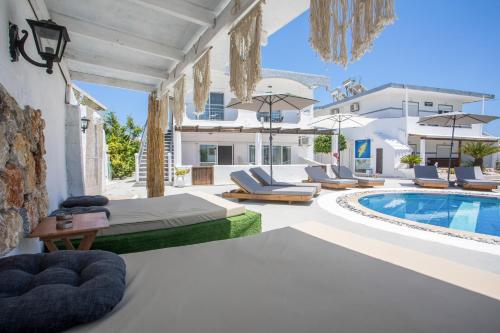 a villa with a swimming pool and a resort at Toula's Apartments in Faliraki
