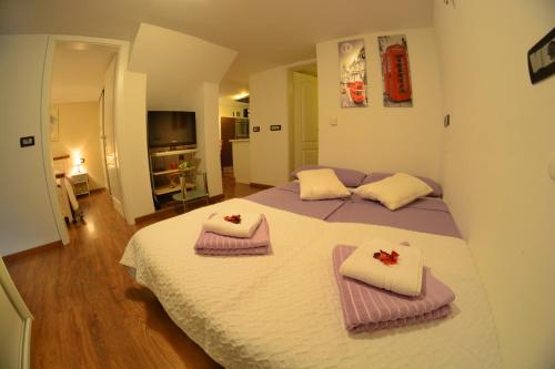 Postel nebo postele na pokoji v ubytování Apartment Arpa