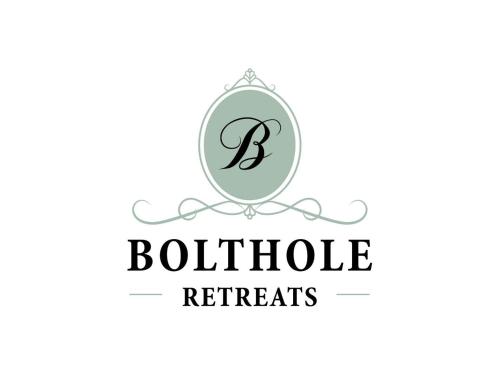 a initial letter b in a circle with a boutique retires logo at Patch Hill House in Finstock