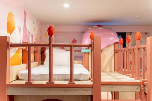 a childs bedroom with two bunk beds and a crib at PLAY!! Resi Stay in Kyoto