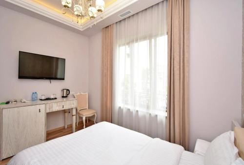Postel nebo postele na pokoji v ubytování Homestay Hotel