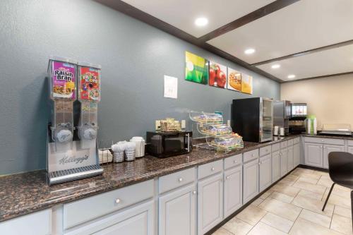 a fast food restaurant with a counter with food at Quality Inn Newton at I-80 in Newton