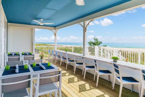 a dining room with a view of the ocean at Hilton Garden Inn Ocean City Oceanfront in Ocean City