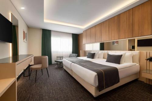 Letto o letti in una camera di FT Lotus Thermal Hotel&SPA Trademark Collection by Wyndham