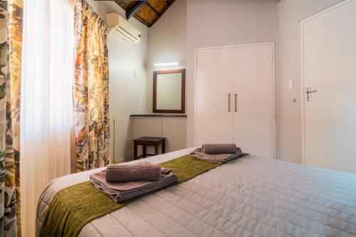 Postel nebo postele na pokoji v ubytování ATKV Eiland Spa