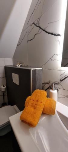 a pair of towels sitting on top of a bathroom counter at Apartments in Graz in Graz