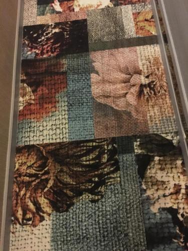 a rug with a picture of a butterfly on the floor at Sohotel in Hong Kong