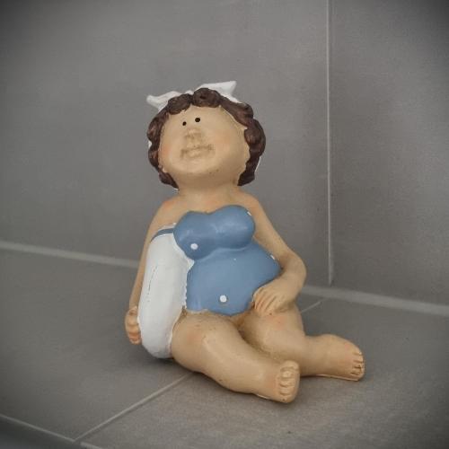 a baby sitting on the floor in a bath tub at Apartments in Graz in Graz