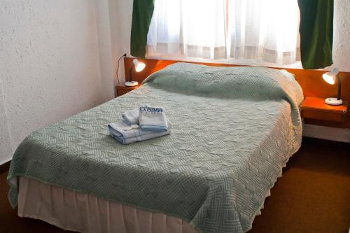 Postel nebo postele na pokoji v ubytování Hotel La Cumbre