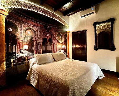 a bedroom with a large bed in a room at Casa Campon in Utrera