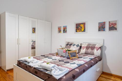 a large bed in a room with white cabinets at Top Center Vasil Levski 2BDR ACC Apartment by SofiaLuxRentals in Sofia