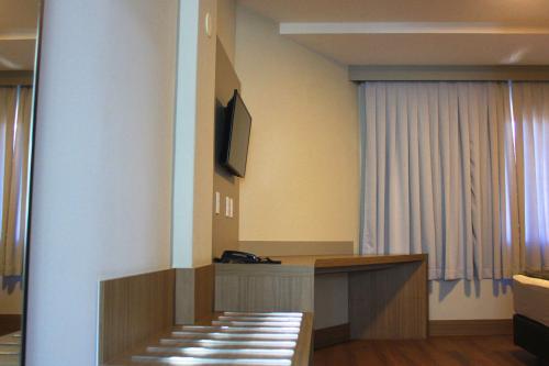 TV a/nebo společenská místnost v ubytování Hotel Évora by Rede Sagres