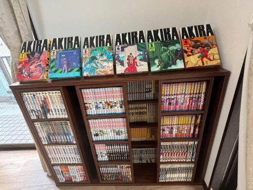 a book shelf filled with video games and comic books at 池袋駅まで電車で7分 4LDK98m2 in Tokyo