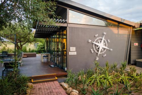 a building with a wall with an anchor painted on it at Aerotel in Hoedspruit
