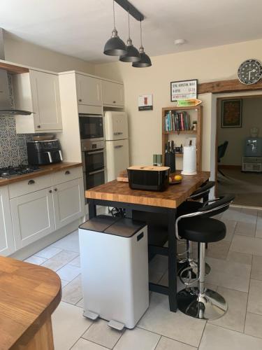 a kitchen with a table with a pan on it at Bodlondeb Holiday Let in Betws-y-coed