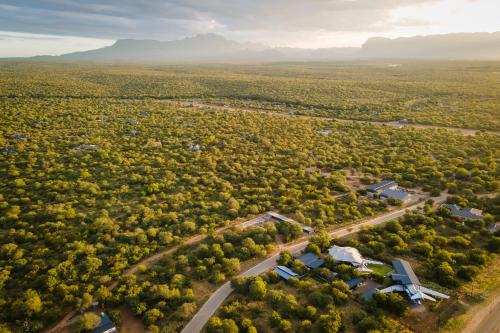 an aerial view of a house in the middle of a forest at Aerotel in Hoedspruit