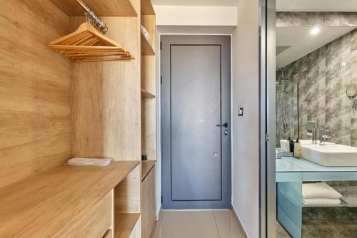 a bathroom with a sink and a mirror at Galini Palace in Kolymvari