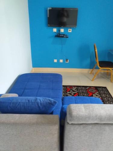Un televizor și/sau centru de divertisment la Les Residences EBAH
