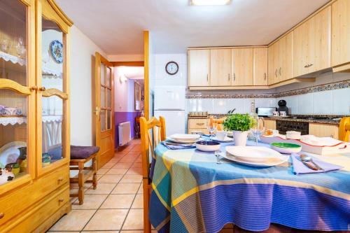 a kitchen with a table with plates on it at Casa Lino in Culla