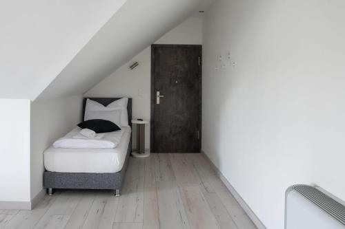 Postel nebo postele na pokoji v ubytování LOTUS Apartman Veszprém