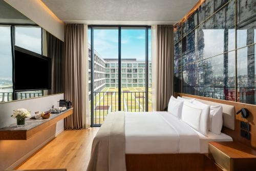 Ένα ή περισσότερα κρεβάτια σε δωμάτιο στο Rixos Tersane Istanbul