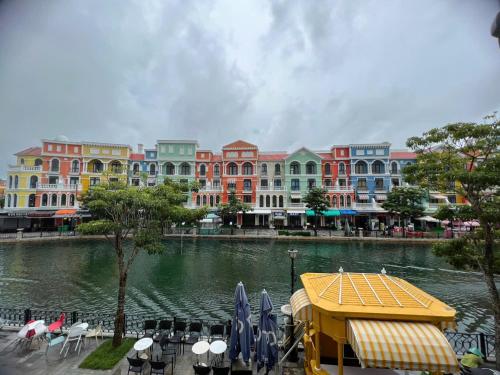 a group of buildings next to a body of water at Thiên Ý Homestay in Phu Quoc