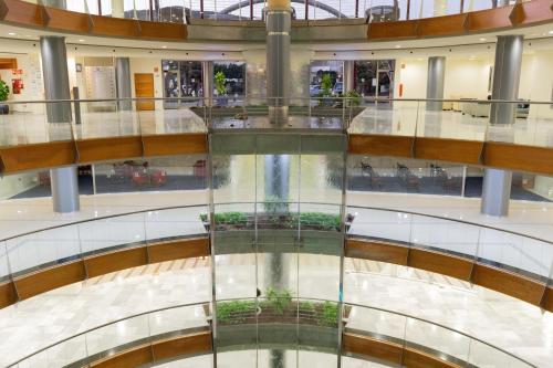 an empty mall with a glass floor in a mall at R2 Hotel Pajara Beach in Costa Calma
