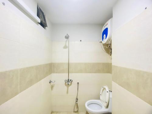 a bathroom with a toilet and a shower at Three Bed Premium Apartment in Islamabad