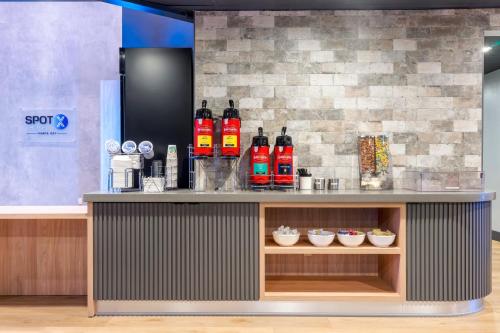 a counter with a bunch of fire hydrants on it at SPOT X Hotel Tampa - Wesley Chapel by The Red Collection in Wesley Chapel