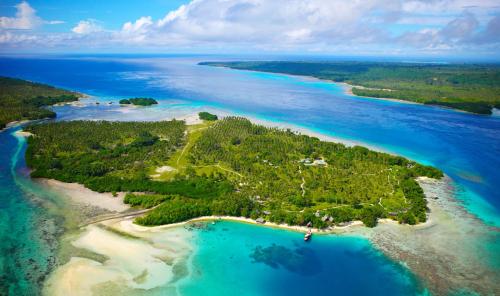 an aerial view of an island in the ocean at Ratua Private Island Resort in Aimbuei Bay