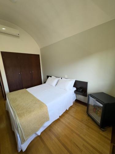 Arcadas Hotelにあるベッド