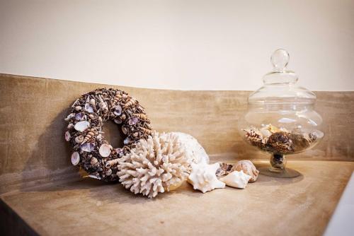 two donuts sitting on a table next to a glass jar at Villa Reynaert in Opoeteren