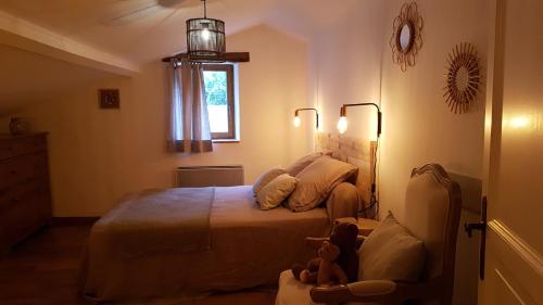 Katil atau katil-katil dalam bilik di Les Demeures Azélie & SPA