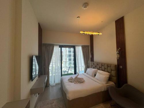 Postel nebo postele na pokoji v ubytování Stunning Studio in Meydan