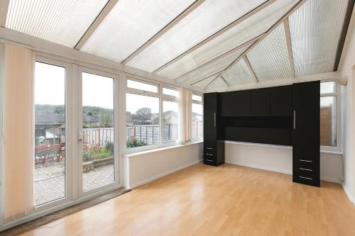 an empty living room with large windows and a ceiling at Amazing 3Bed 2Bath House with Garden, Parking, WiFi Near Stevenage Train Station in Aston End