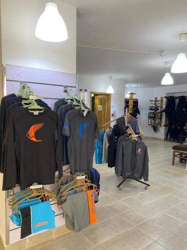 a store with a bunch of clothes on display at Blue Vision Diving Hotel in Marsa Alam City
