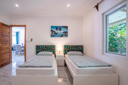 Ένα ή περισσότερα κρεβάτια σε δωμάτιο στο Jambiani Residence