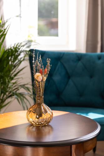 a vase sitting on a table on a table at Apartmány Vilka Orlík in Teplice nad Metují
