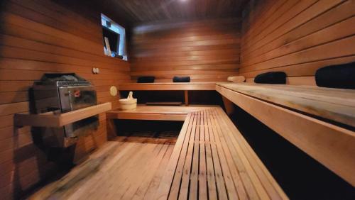 an empty cabin with wooden walls and wooden floors at Riverview Georgian House in Donaghmore Bridge