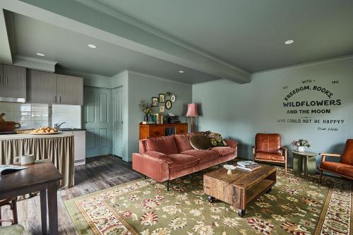 a living room with a couch and a table at Westwood Lodge in Bright