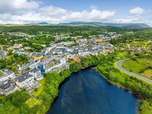 an aerial view of a town next to a river at Apartment 453 - Clifden in Clifden