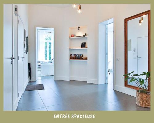 a living room with a mirror and a hallway at La bulle bohème - Entièrement neuf, près de Spa in Verviers