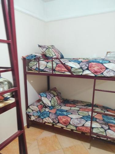 Ένα ή περισσότερα κρεβάτια σε δωμάτιο στο Alexandria Hostel هوستل الاسكندرية